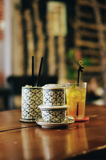 White and Black Cups and drinking glass