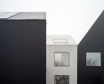 white and black house with clear full-glass window