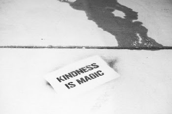 white and black Kindness is Magic text