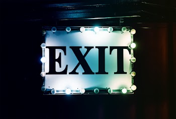 White and Black Lighted Exit Signage