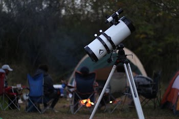 white and black telescope