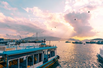 White and Blue Boat on Body of Water