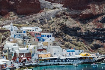 White and Blue Houses Beside Body of Water