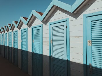 White and Blue Wooden Building Under Blue Sky