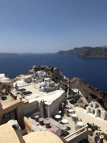 White and Brown Concrete Building Near Body of Water