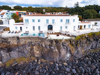 White and Brown Concrete Building On A Cliff