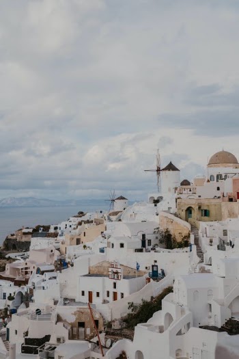 White and Brown Concrete Houses Under White Clouds · Free Stock Photo