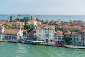 White and Brown High Rise Building Near Body of Water