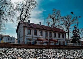 White and Brown House Across Train Tracks