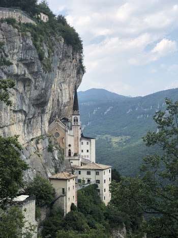 White and Brown House Beside Cliff