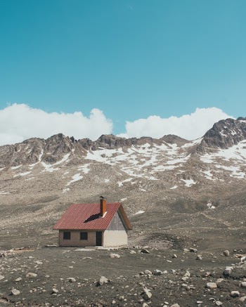 White and Brown House Near Mountains