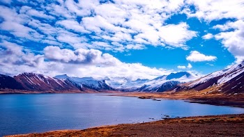 White and Brown Mountains and White Cirrus Clouds
