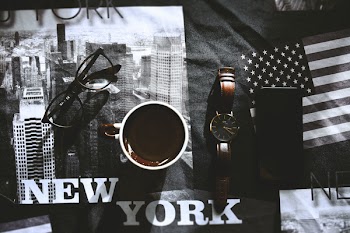 White and Brown Mug Beside Brown Watch
