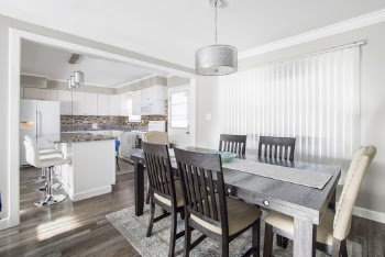 White and Brown Wooden 7-piece Dining Set in Room