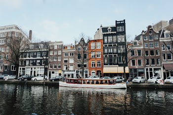White And Brown Wooden Boat On Body Of Water