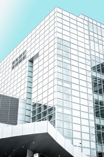 white and clear glass high-rise building