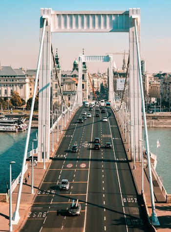 White and Gray Bridge With Vehicles