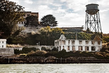 White and Gray House Beside Body of Water