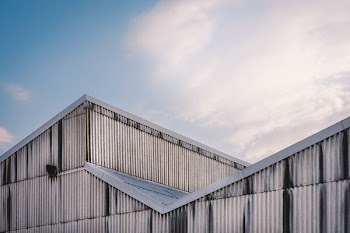 white and gray metal building during daytime ]