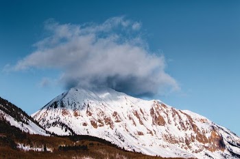 white and gray mountain under blue sky at daytime