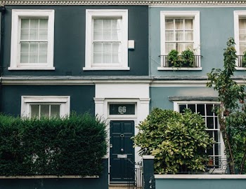 white and green painted house