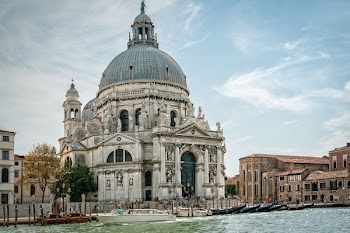 White and Grey Cathedral Under Cloudy Blue Sky during Daytime