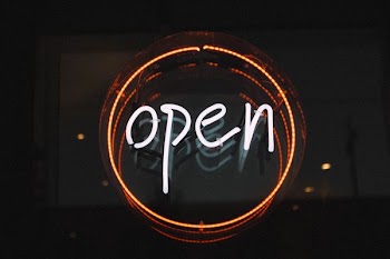 white and orange open LED signage turned on