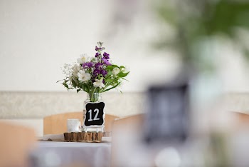 White and Purple Petaled Flowers Centerpiece on Table in Selective Focus Photography