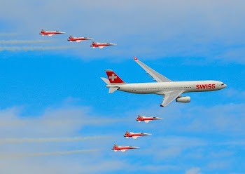 white and red airplane during daytime