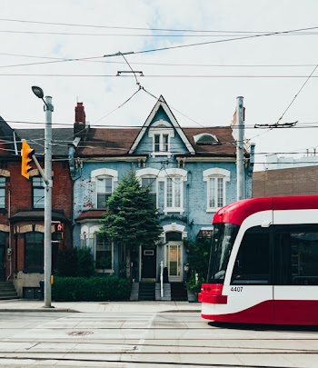 White and Red Cable Train in the Middle of the Street