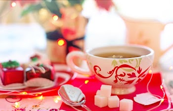 White and Red Ceramic Cup on Red Surface