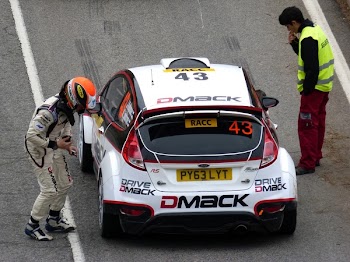 White and Red Dmack Car on Road