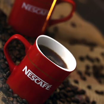 White and Red Nescafe Ceramic Coffee Mug With Coffee