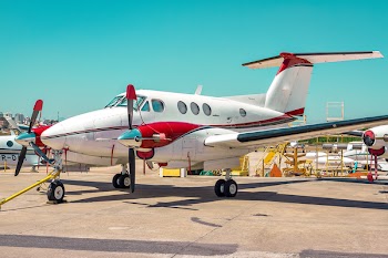 White and Red Plane Land