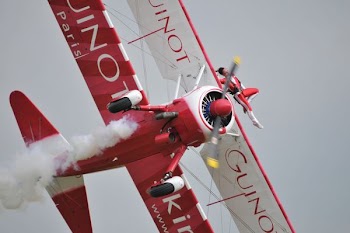 white and red propeller plane