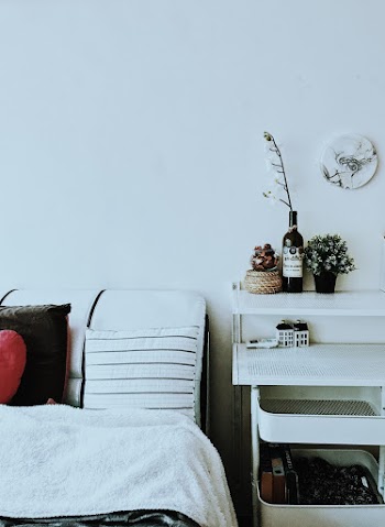 White Bed Beside Wall