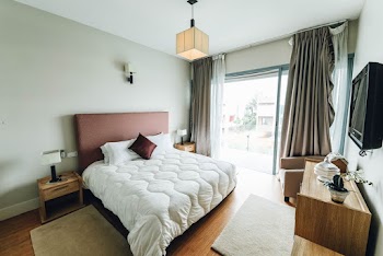 White Bed Near Window