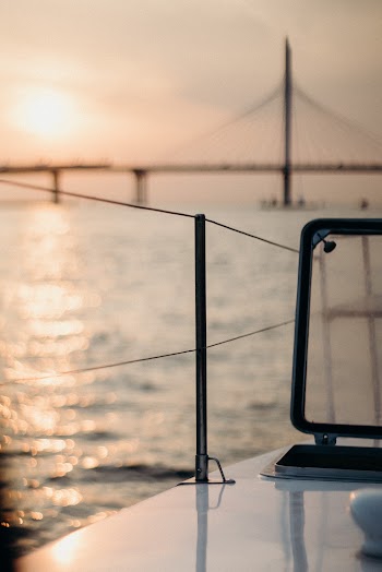 White Boat Across Bridge