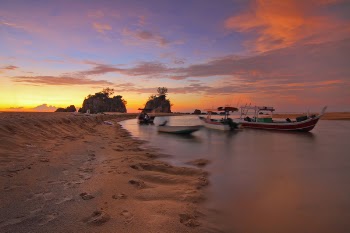 White Boat Docking on Seashore during Sunset