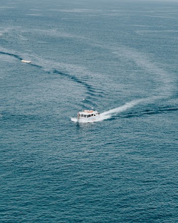 White Boat In The Middle Of The Ocean