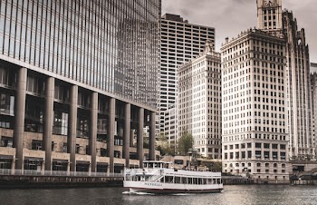 White Boat Near City Building