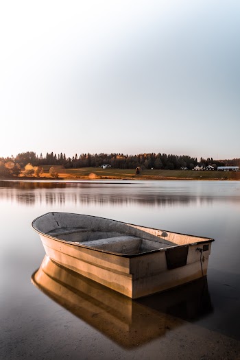 White Boat on Body of Water
