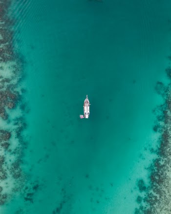 White Boat on Body of Water