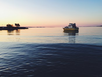 White Boat on Body of Water
