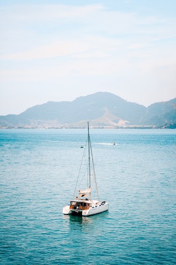 White Boat On Body Of Water