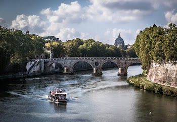 White Boat on Body of Water Crossing a Gray Concrete Bridge during Daytime