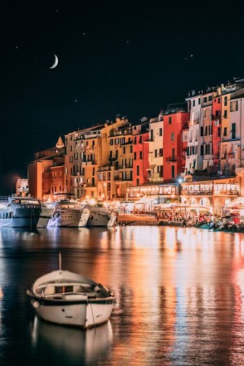 white boat on water during night time