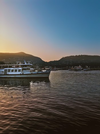 White Boat on Water during Sunset
