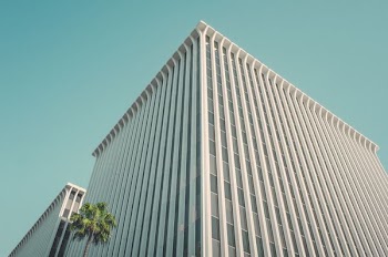 white building beside tree during daytime