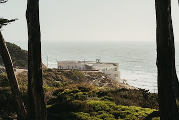 White Building Near Body of Water